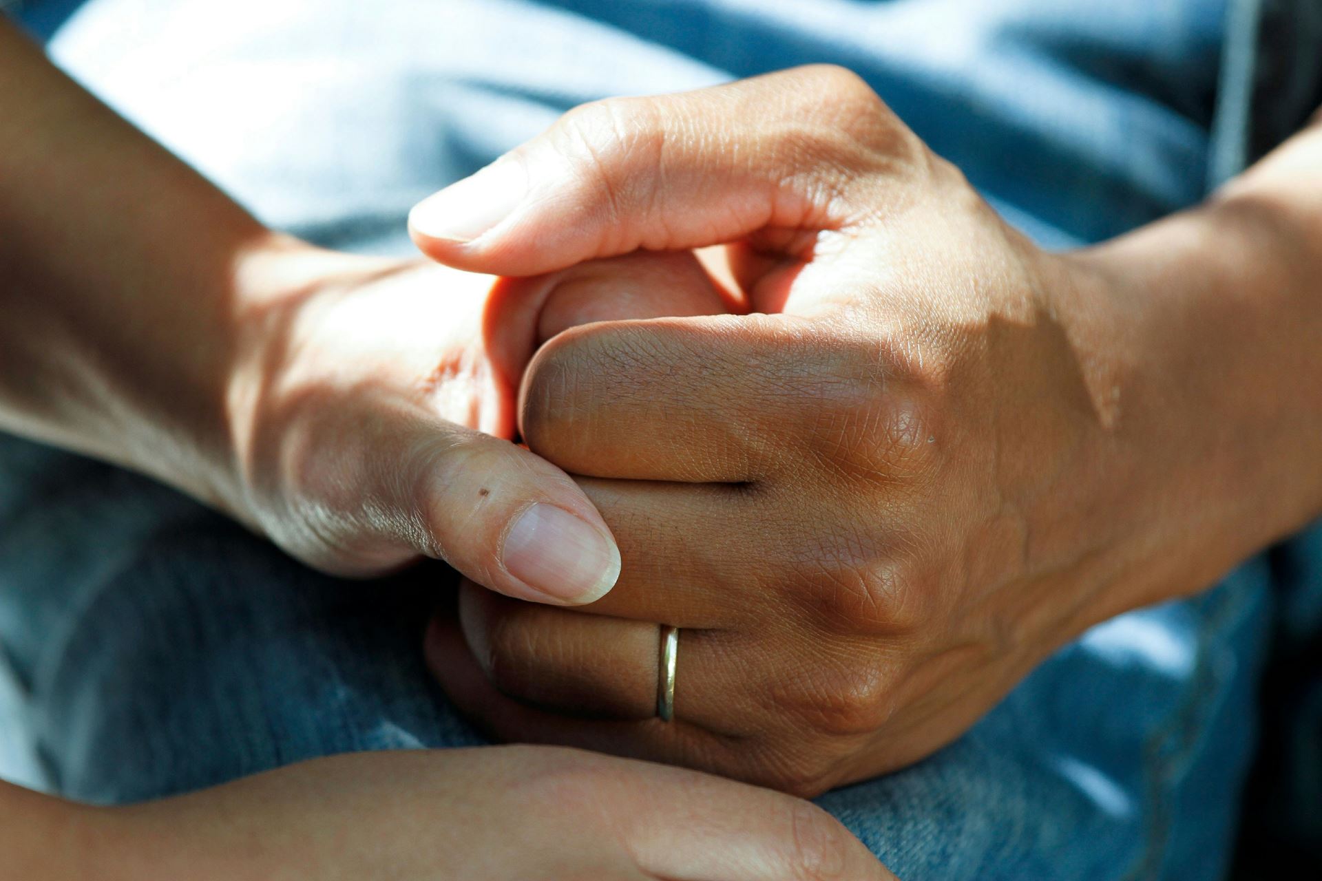 picture showing 2 people holding hands 